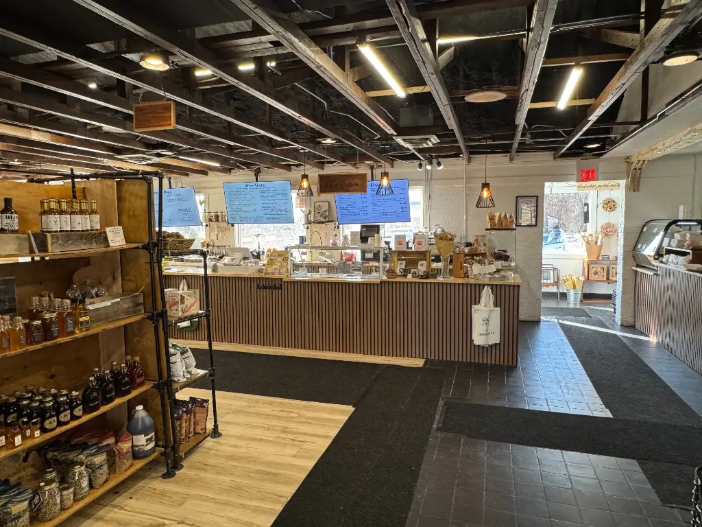 The organic cafe corner at CC's Market with shelves of goods and a coffee bar